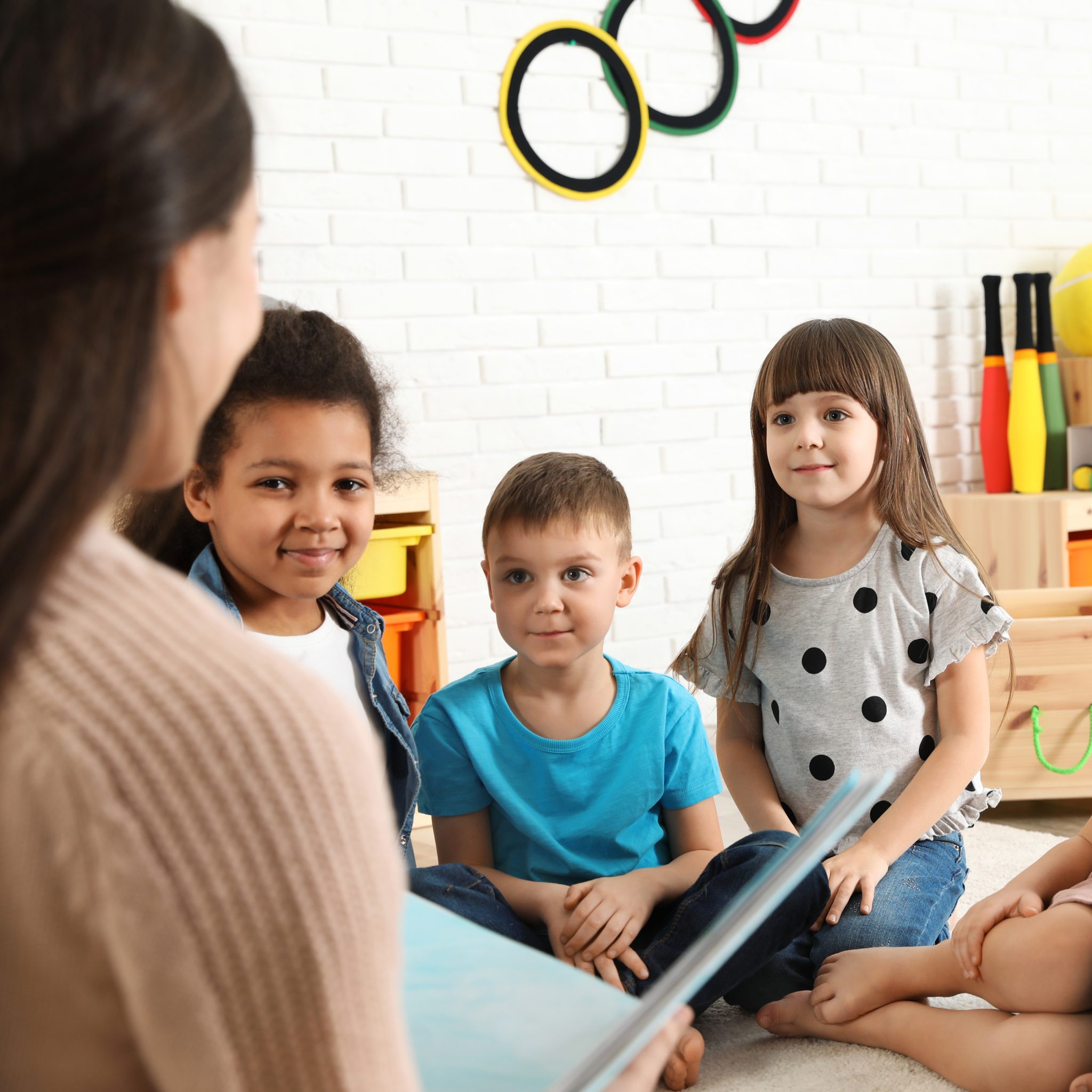 A person reading to a group of children