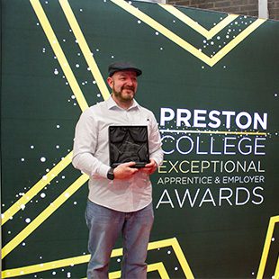 Man holding an award
