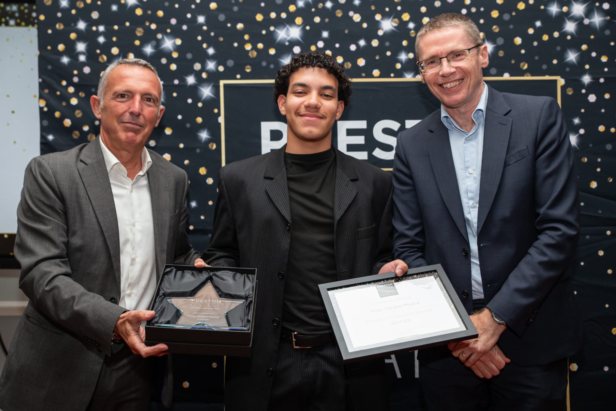 Yensi - a student winner stood with Chair of the Board Jose Sedano-Martinez and Principal and Chief Executive, Simon Nixon